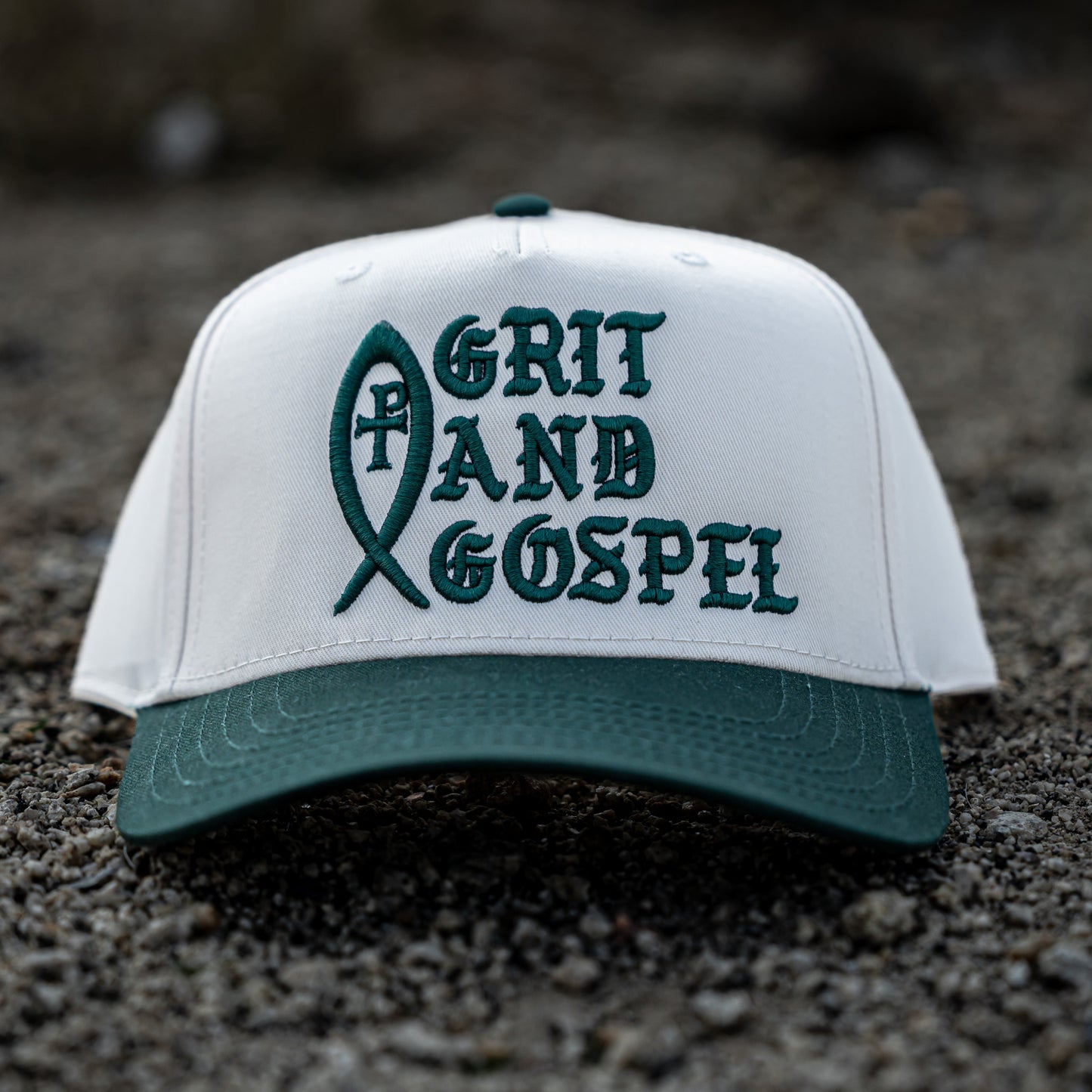 Front of two-tone Otto snapback hat with Grit and Gospel puff embroidery green color christian apparel Ichthys
