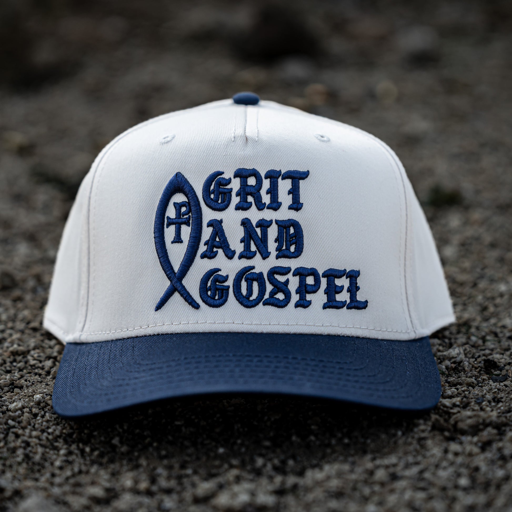 Front of two-tone Otto snapback hat with Grit and Gospel puff embroidery blue color Ichthys christian apparel