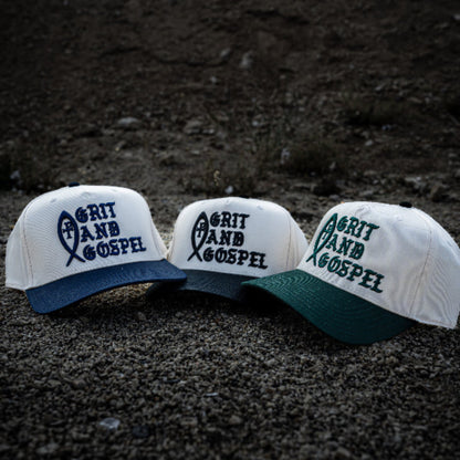 Front of two-tone Otto snapback hat with Grit and Gospel puff embroidery Ichthys christian apparel hat