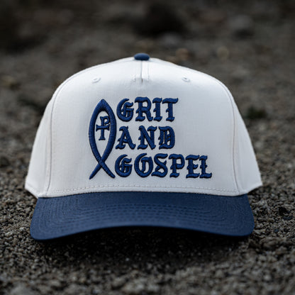 Front of two-tone Otto snapback hat with Grit and Gospel puff embroidery blue color Ichthys christian apparel